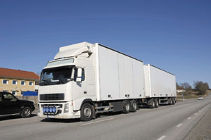 clean truck driving on country-road